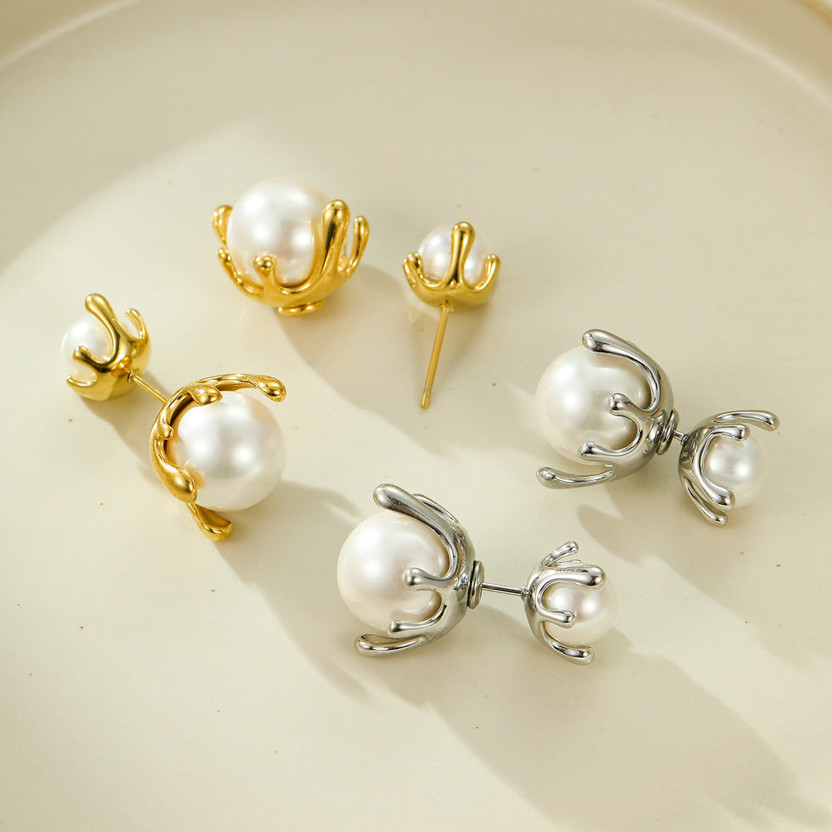 Hot selling earrings with stainless steel earrings inlaid with pearls and a dual directional design, niche earrings