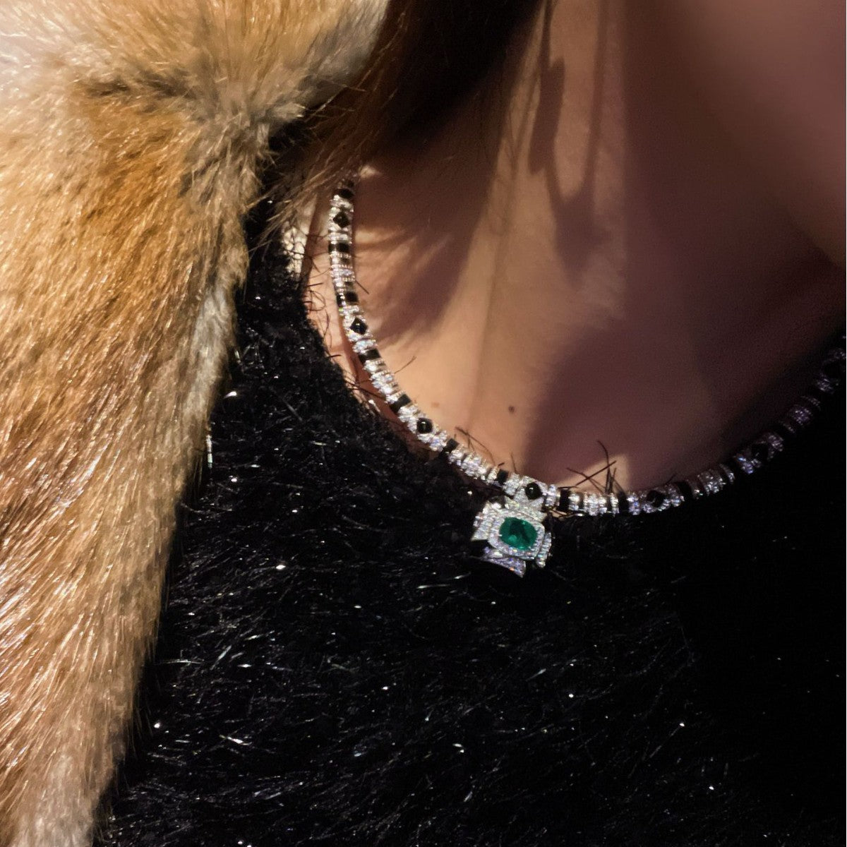 Vintage high-end jewelry design featuring emerald spirit snake necklace set with a luxurious multi chain banquet dress