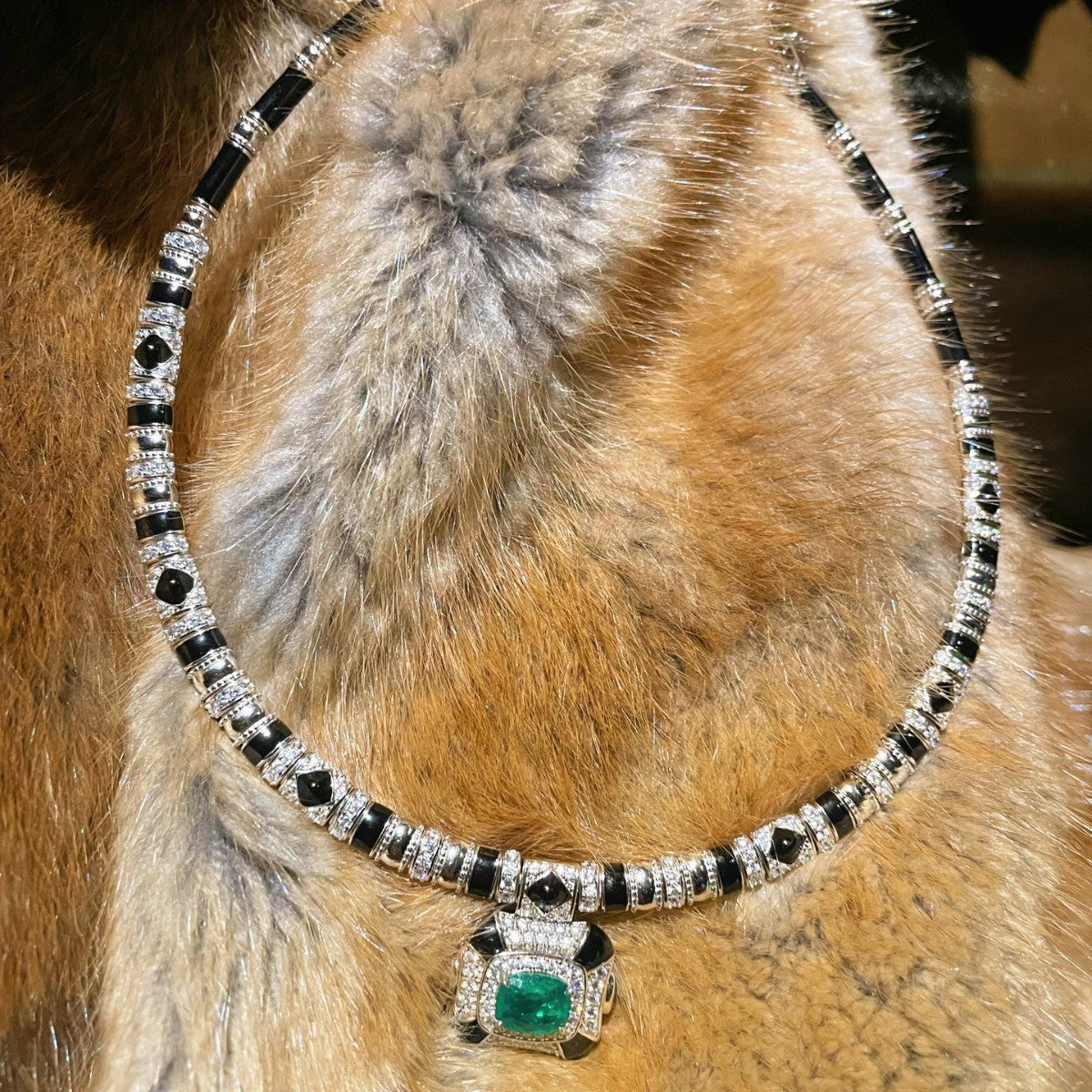 Vintage high-end jewelry design featuring emerald spirit snake necklace set with a luxurious multi chain banquet dress