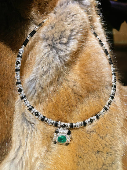 Vintage high-end jewelry design featuring emerald spirit snake necklace set with a luxurious multi chain banquet dress